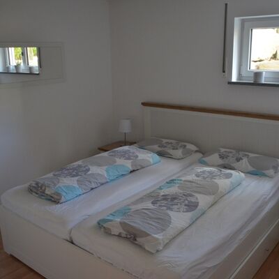 Ferienwohnung am Schloss Schlafzimmer mit Doppelbett